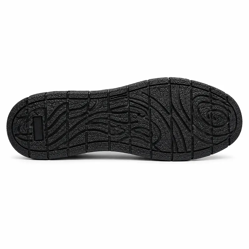 TruTuff Volt sole view — oil and acid resistant rubber outsole with deep tread channels, anti-slip safety shoe