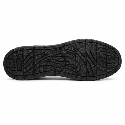 TruTuff Volt sole view — oil and acid resistant rubber outsole with deep tread channels, anti-slip safety shoe